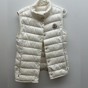 Girls Monclear white vest. Size 8. Used with slight discoloring and pink stain